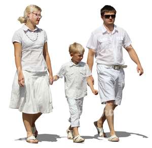 family dressed in white walking hand in hand