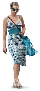 cut out woman in a blue summer dress walking