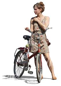 cut out woman in a dress standing by a bicycle