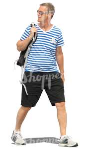 man in a striped shirt walking