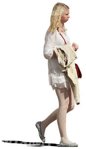 cut out blond woman in a white dress walking
