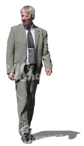 cut out elderly businessman walking