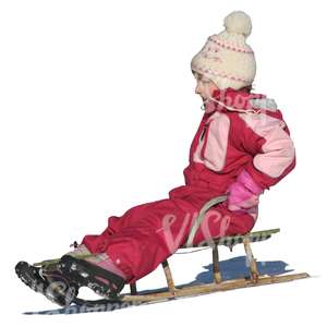 little girl sledging downhill