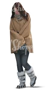 cut out woman in a brown winter coat walking