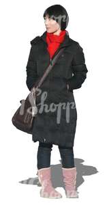 cut out woman in a black coat walking