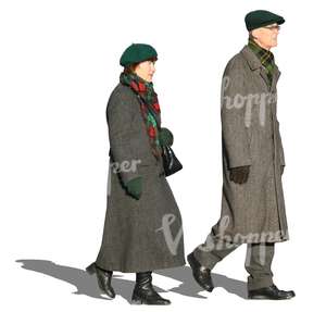 man and woman in grey winter coats walking