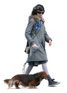 cut out woman walking a dachshund