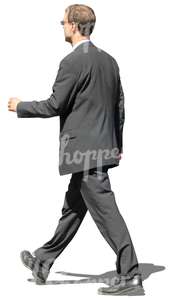 man in a grey suit walking