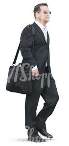 businessman walking with a bag over his shoulder