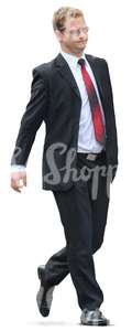 young businessman in a black suit walking