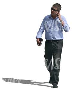 businessman walking and talking on the phone
