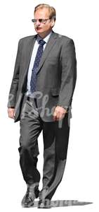 cut out businessman in a grey suit walking