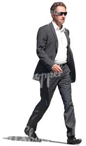 businessman with sunglasses walking