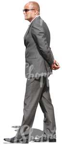businessman with sunglasses walking