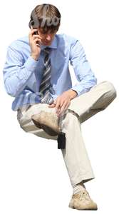 cut out businessman sitting and talking on the phone