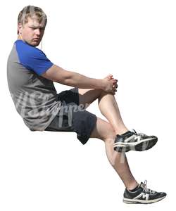 young man sitting and listening to music