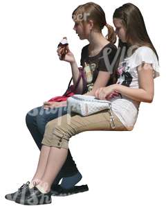 two cut out girls sitting and eating ice cream