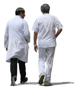 two cut out male doctors walking