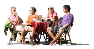 four people sitting in a street cafe