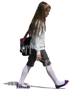 young girl with a scool bag walking