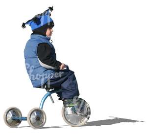 cut out boy riding a three-wheeled bike