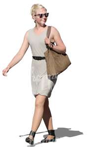 blonde woman in a summer dress walking