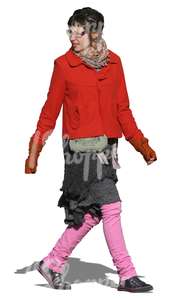 woman in a colorful outfit walking in autumn
