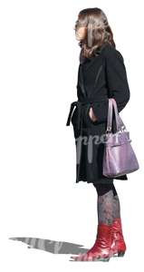 cut out woman in a black coat standing