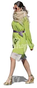 cut out woman in a green dress walking