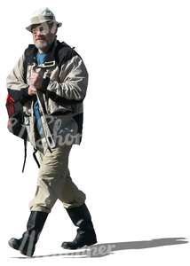 elderly man in wellies walking