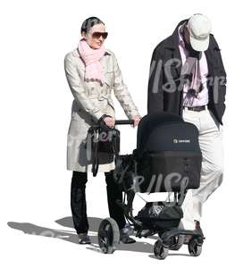 cut out man and woman walking a baby in autumn