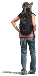 woman with a backpack standing and looking