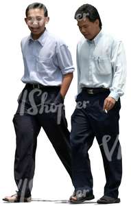 two asian businessmen walking and talking