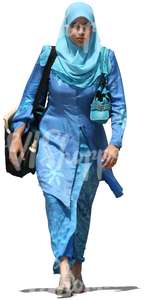 cut out muslim woman in a blue dress walking