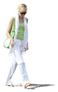 woman in white summer pants walking