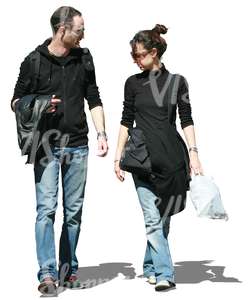 couple wearing jeans walking and talking