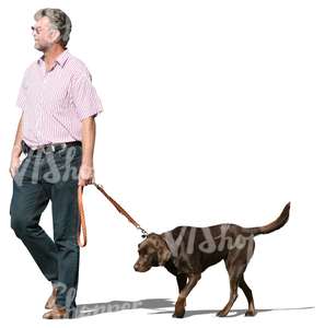middle-aged man walking a dog