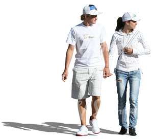 couple in white clothes walking hand in hand