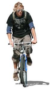 teenage boy riding a bike