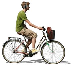 young man with headphones riding a bike