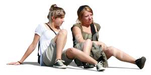 two women sitting on the ground