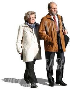 elderly couple walking arm in arm