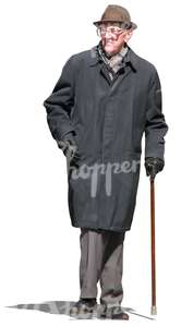 elderly man walking with a walking stick