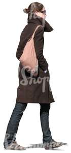 woman in a brown coat walking