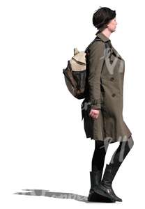 woman in a brown trench coat walking