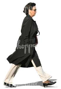 woman in a black autumn coat walking