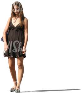 woman in a brown summer dress standing