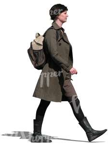 woman in a brown spring coat walking