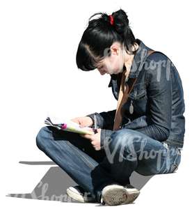 young woman sitting and reading a newspaper