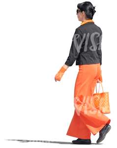 woman in a black and orange outfit walking